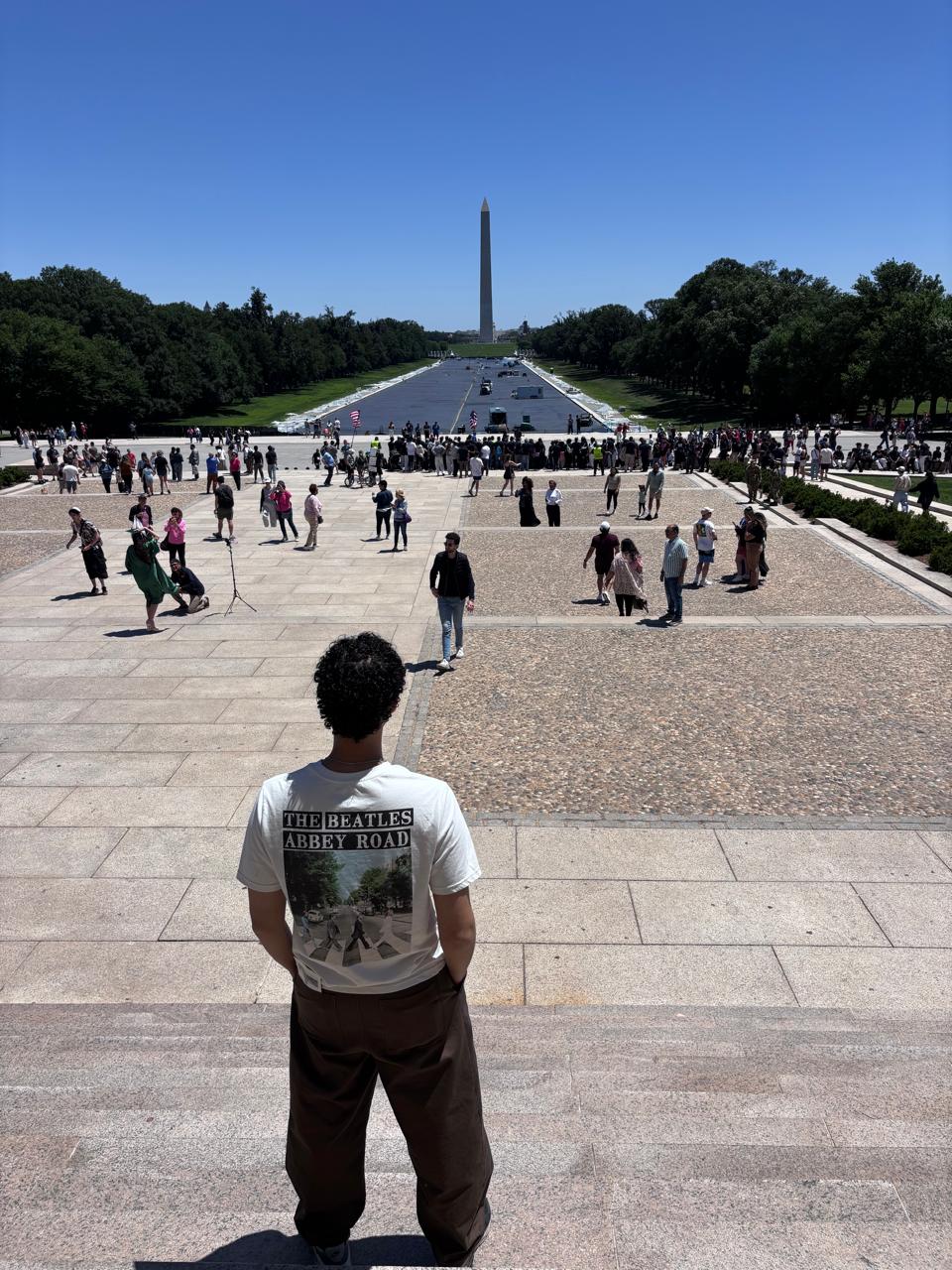 Standing at the top of the Lincoln Memorial steps, looking down the Reflecting Pool toward the Washington Monument